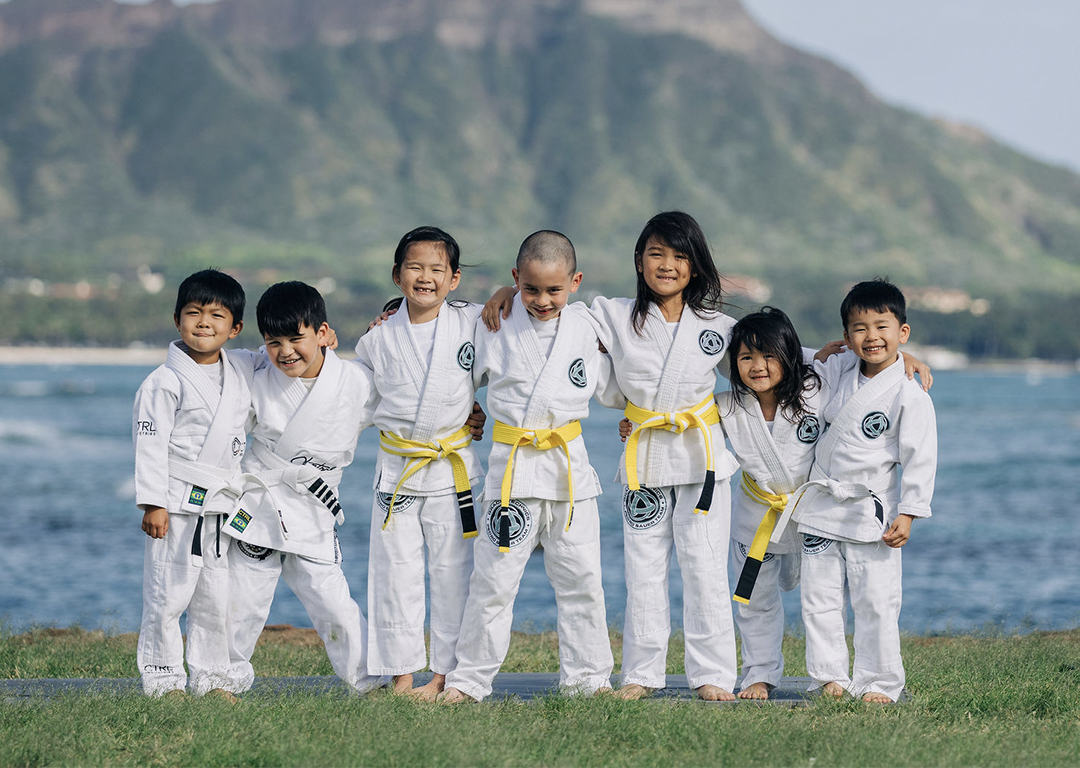 Technics kids in gis in front of Diamond Head
